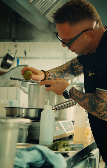 Chef finishing a dish in the Bellini kitchen