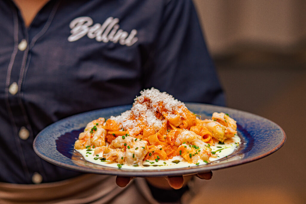 A plate of pasta carried to the table